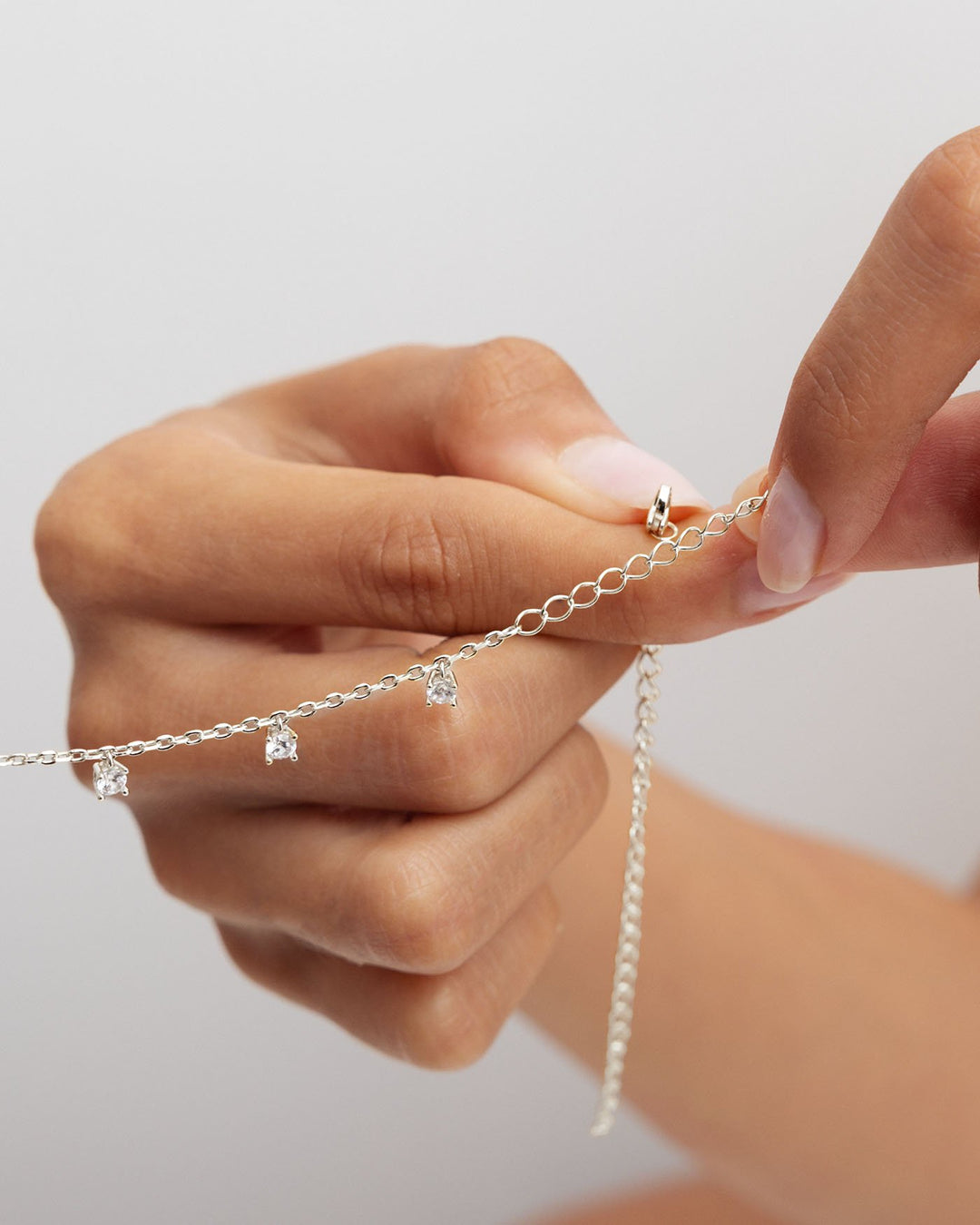 estensore argento applicato su choker con pendenti